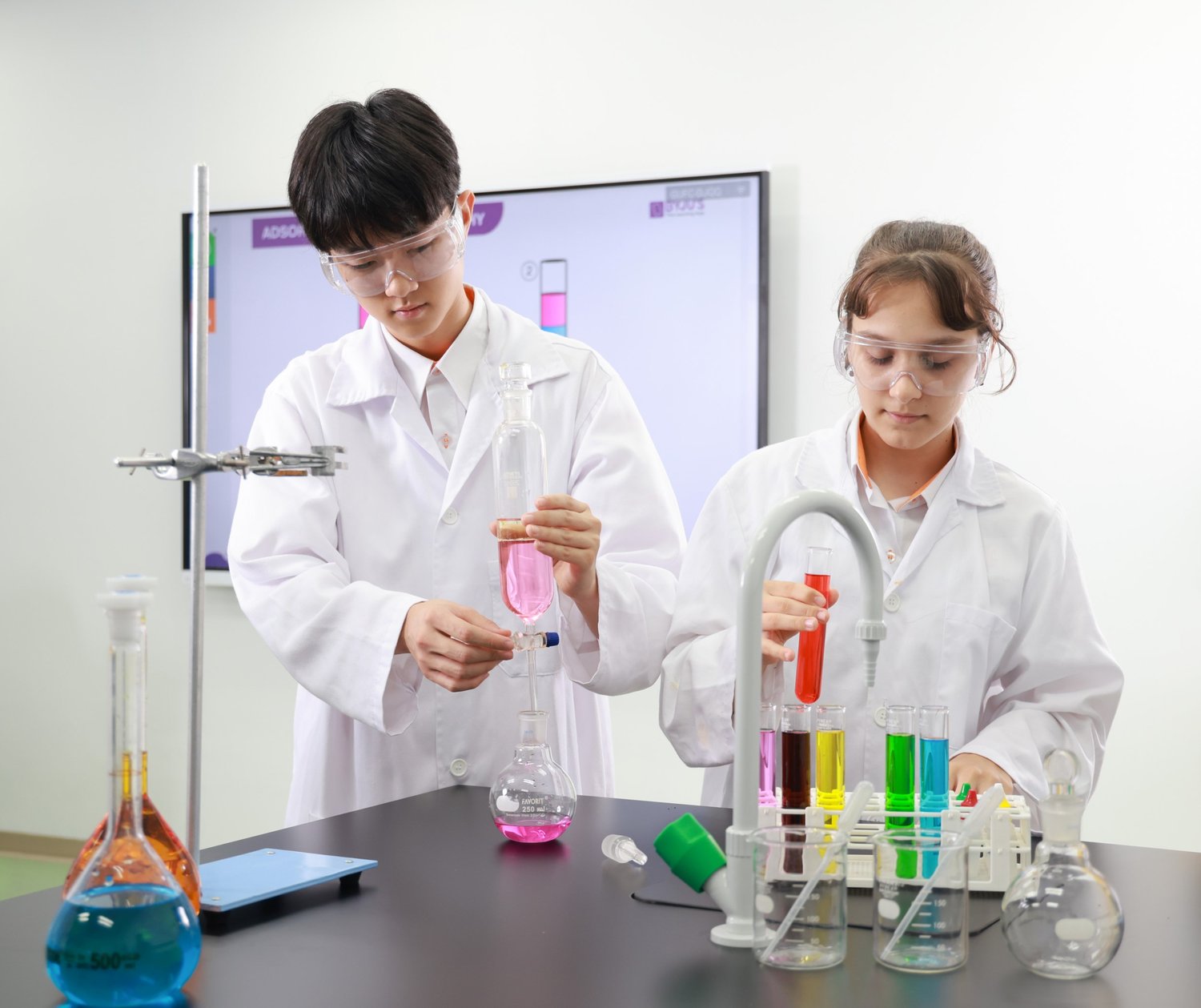 Senior students in a science lab at SIS